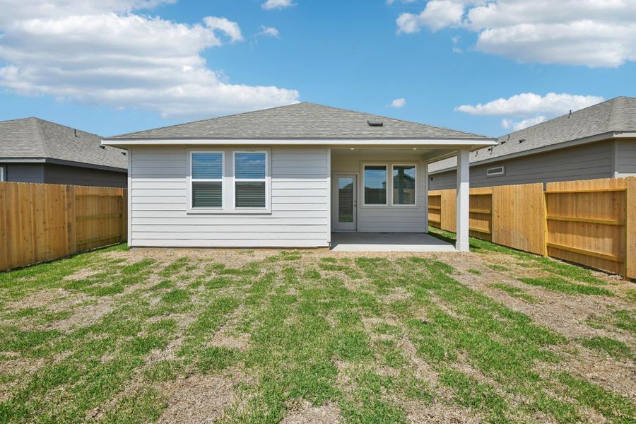 Exterior details and patio area of a home in Sanford Farms - Traditional Series, Waller (Image 28).