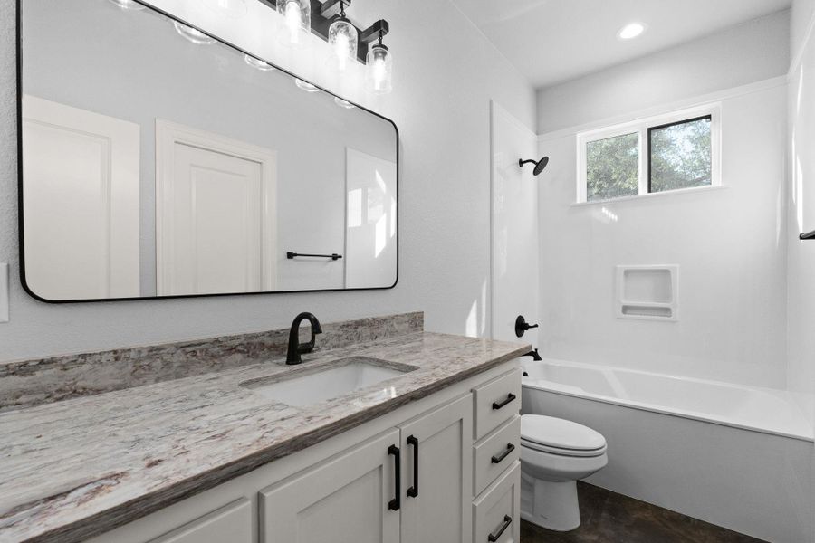 Full bathroom featuring vanity and shower / tub combination