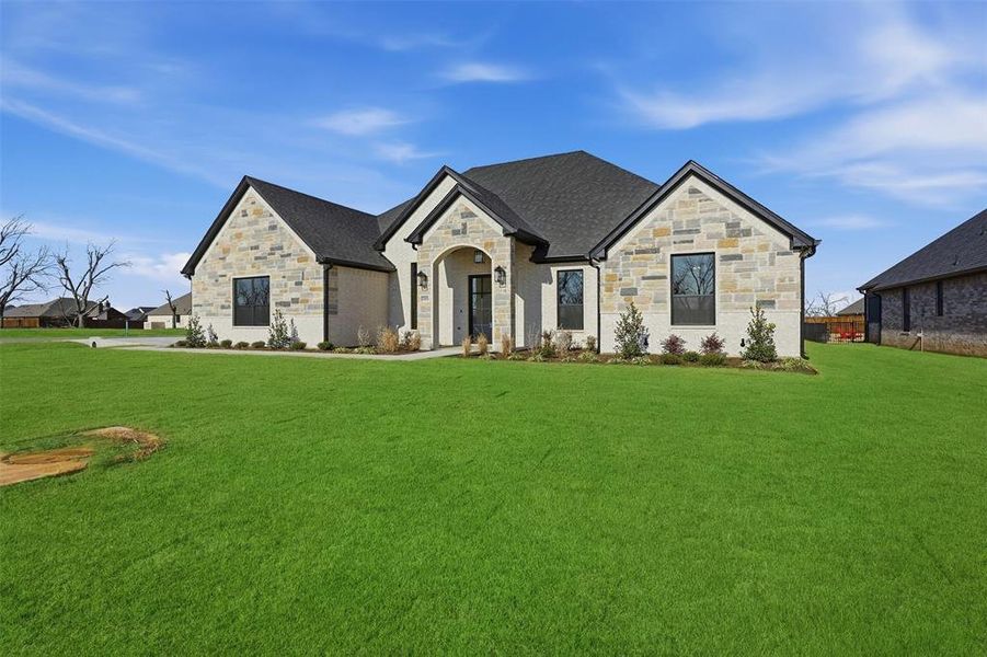 Front exterior of a new home in , Granbury, TX, highlighting curb appeal (Image 27). Front exterior of a new home in , Granbury, TX, highlighting curb appeal (Image 27).