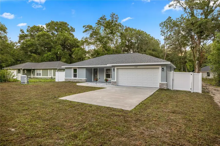 Front exterior of a new home in , Summerfield, FL, highlighting curb appeal (Image 2). Front exterior of a new home in , Summerfield, FL, highlighting curb appeal (Image 2).