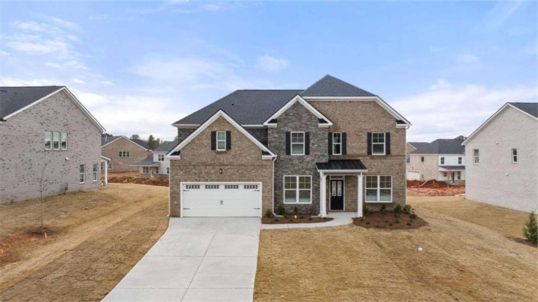 Front exterior of a new home in The Gates at Pates Creek, Hampton, GA, highlighting curb appeal (Image 21).