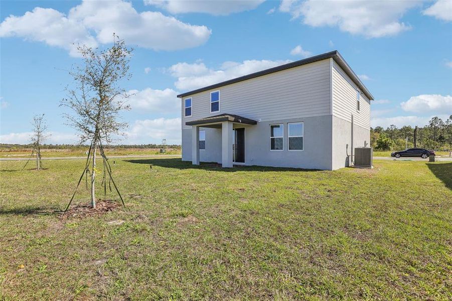 Exterior details and patio area of a home in Lake Deer Estates - Signature Series, Poinciana (Image 24). Exterior details and patio area of a home in Lake Deer Estates - Signature Series, Poinciana (Image 24).