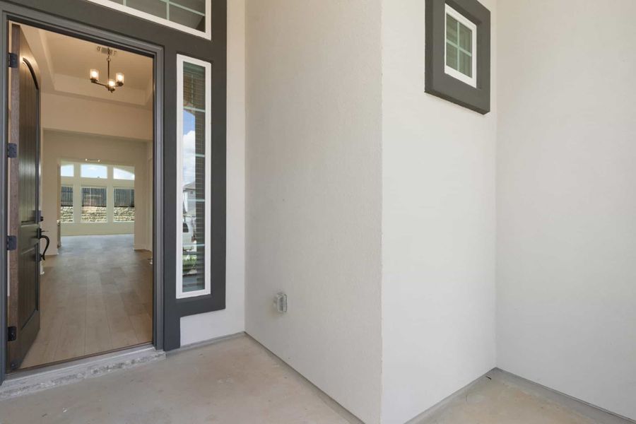 Exterior details and patio area of a home in Lariat, Liberty Hill (Image 16).