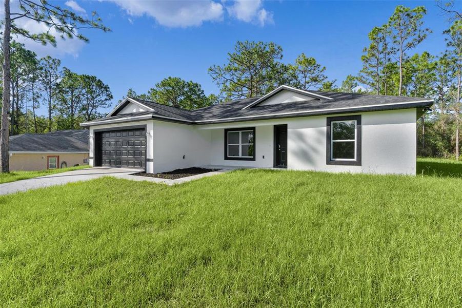 Front exterior of a new home in , Citrus Springs, FL, highlighting curb appeal (Image 21).