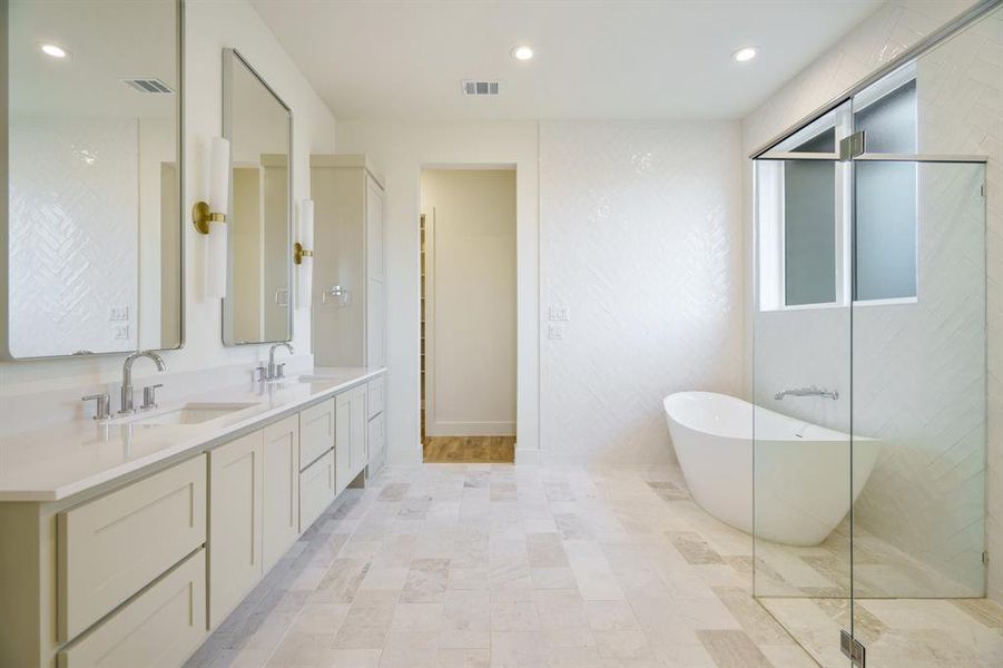 Bathroom with vanity and separate shower and tub