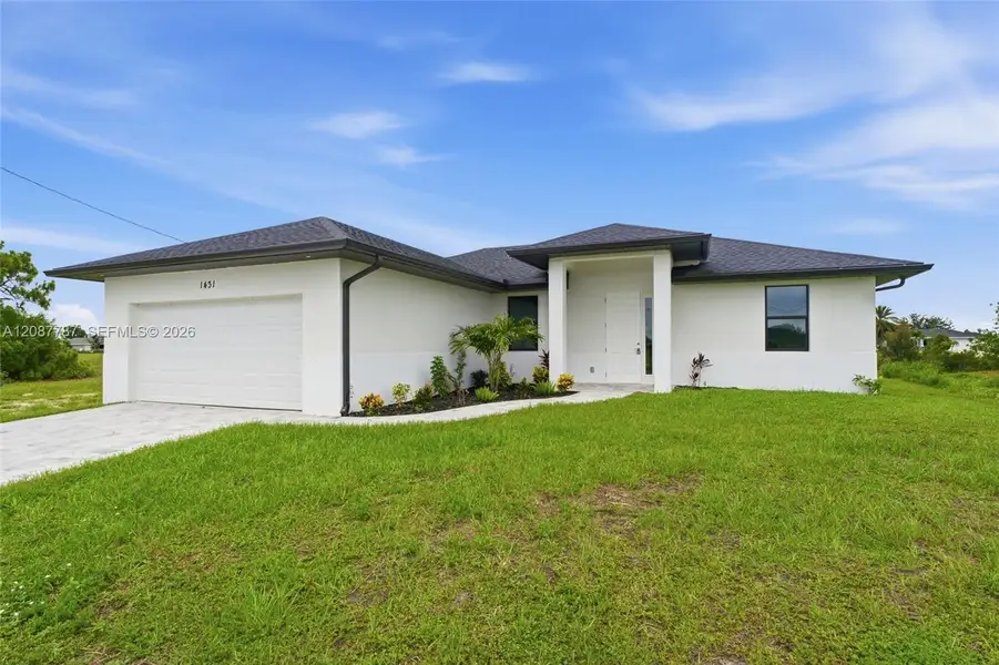 Front exterior of a new home in , Cape Coral, FL, highlighting curb appeal (Image 1). Front exterior of a new home in , Cape Coral, FL, highlighting curb appeal (Image 1).