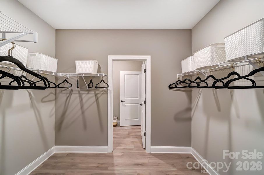 Primary closet connects to laundry room