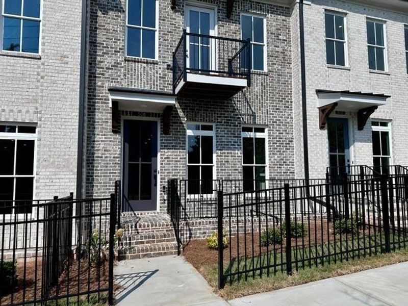 Exterior details and patio area of a home in Ward's Crossing Townhomes, Johns Creek (Image 18). Exterior details and patio area of a home in Ward's Crossing Townhomes, Johns Creek (Image 18).