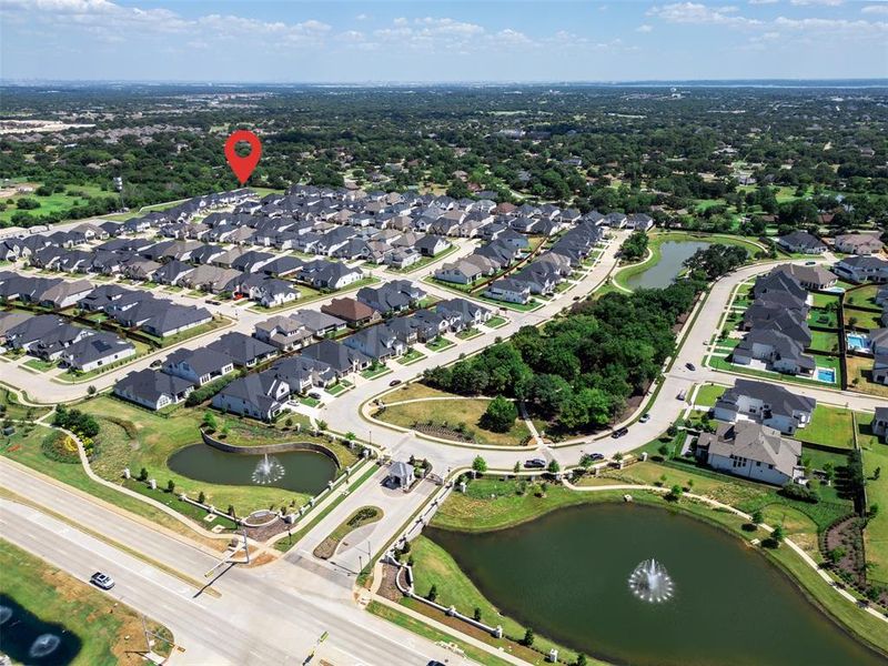 Aerial view of property's location featuring nearby suburban area and a large body of water