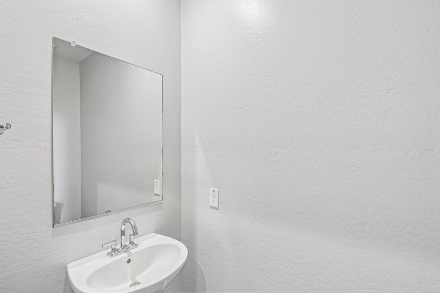 A bathroom with a mirror. A bathroom with a mirror.