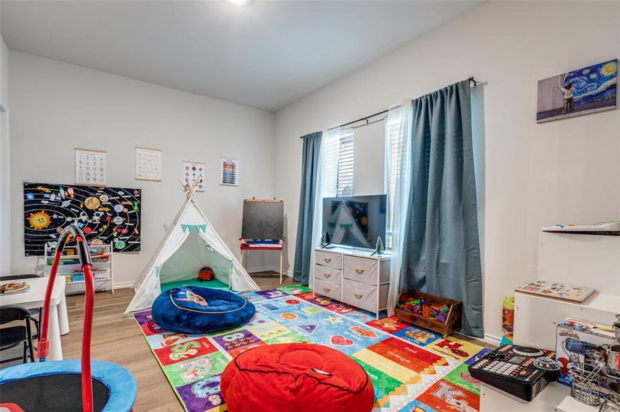 Rec room featuring wood finished floors Rec room featuring wood finished floors