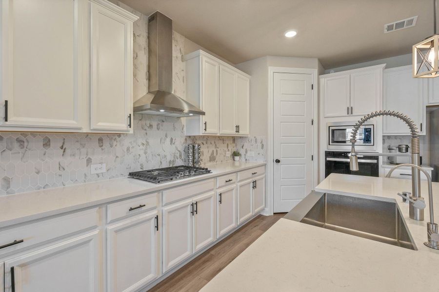 This home offers upgraded door knobs throughout the home; complimented with upgraded door hinges in elegant black color offering a modern aesthetic. This home offers upgraded door knobs throughout the home; complimented with upgraded door hinges in elegant black color offering a modern aesthetic.