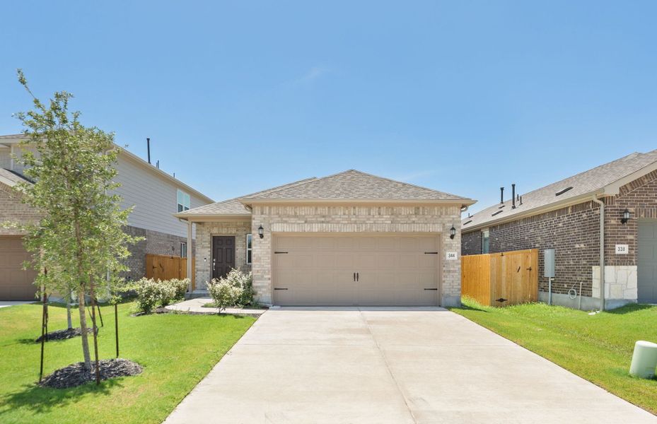 Front exterior of a new home in Crosswinds, Kyle, TX, highlighting curb appeal (Image 19). Front exterior of a new home in Crosswinds, Kyle, TX, highlighting curb appeal (Image 19).