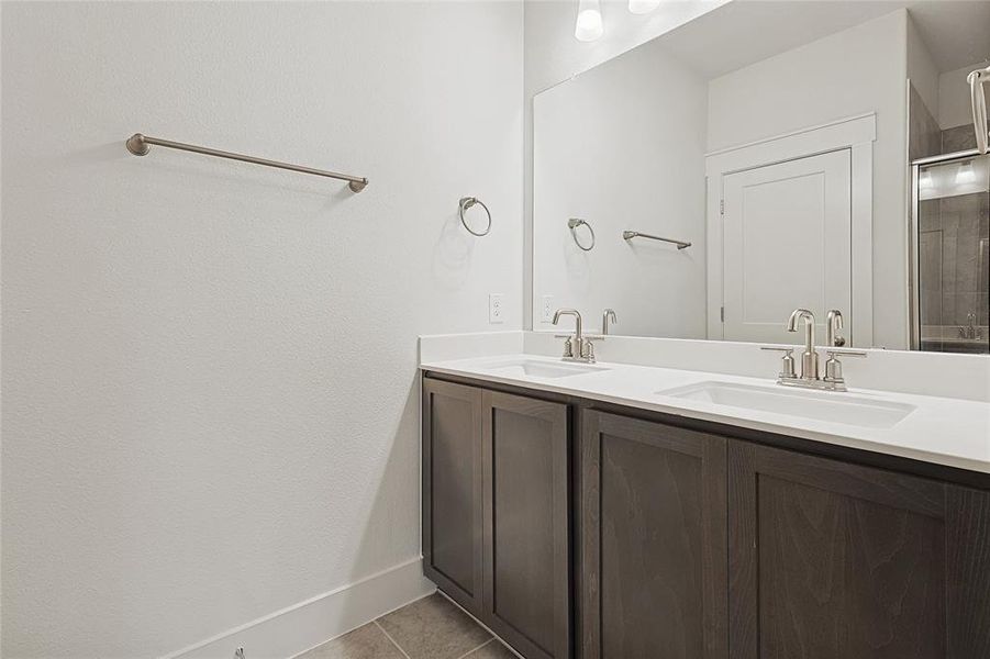 Bathroom with tile patterned flooring and vanity