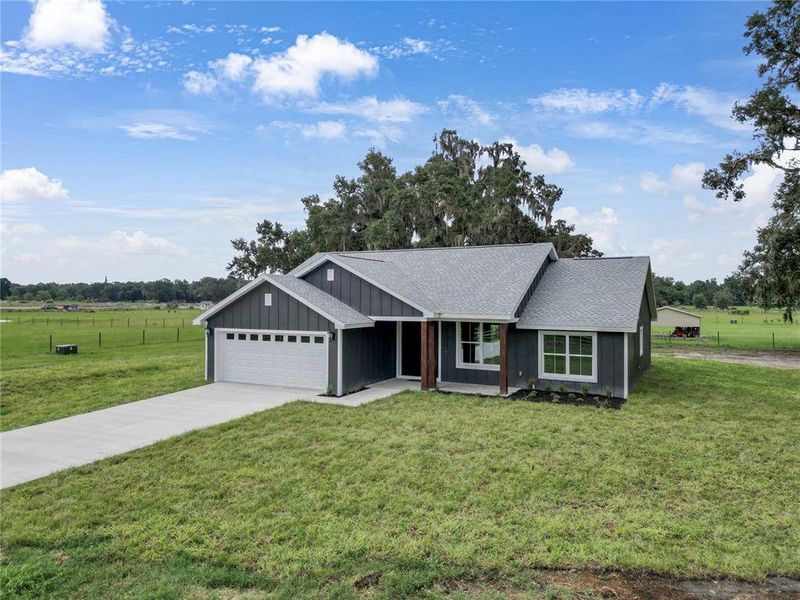 Front exterior of a new home in , Bushnell, FL, highlighting curb appeal (Image 20).