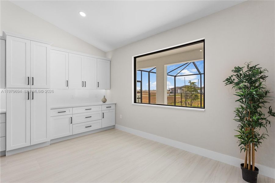 DINING ROOM features bright, modern design, neutral tones & vaulted ceiling w/ recessed lighting that enhances the open feel. BUILT-IN CUSTOM WHITE CABINETRY provides ADDED STORAGE & CLEAN, UPSCALE LOOK. DINING ROOM features bright, modern design, neutral tones & vaulted ceiling w/ recessed lighting that enhances the open feel. BUILT-IN CUSTOM WHITE CABINETRY provides ADDED STORAGE & CLEAN, UPSCALE LOOK.