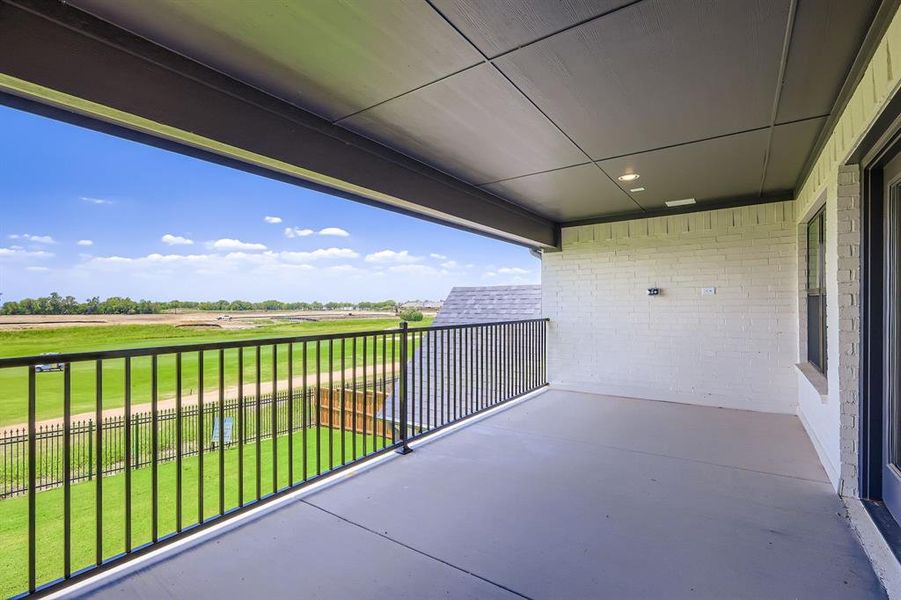 Balcony featuring view of golf course