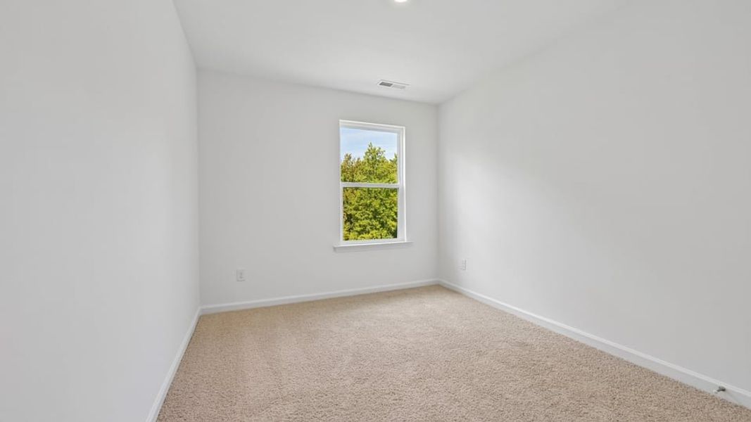 Spacious, unfurnished interior of a new home in The Townes at Belle Grove, Wendell (Image 19).