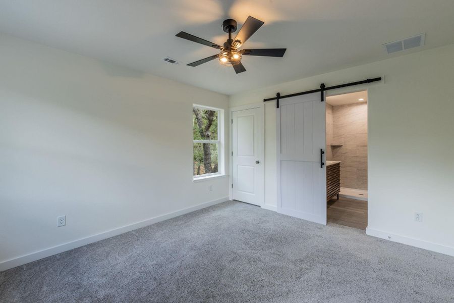 Room featuring neutral-toned carpeting and a single window Room featuring neutral-toned carpeting and a single window