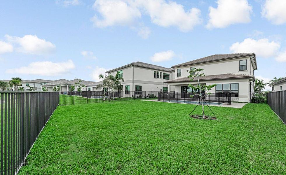 Exterior details and patio area of a home in Apex at Avenir, Palm Beach Gardens (Image 33).