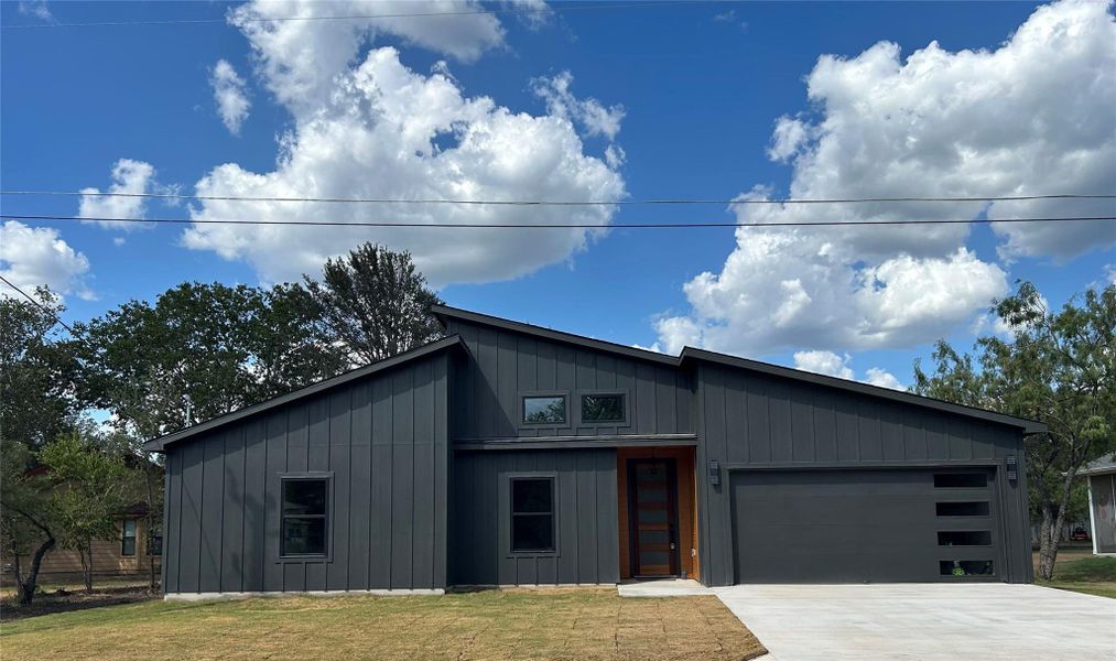 Front exterior of a new home in , Bastrop, TX, highlighting curb appeal (Image 21).