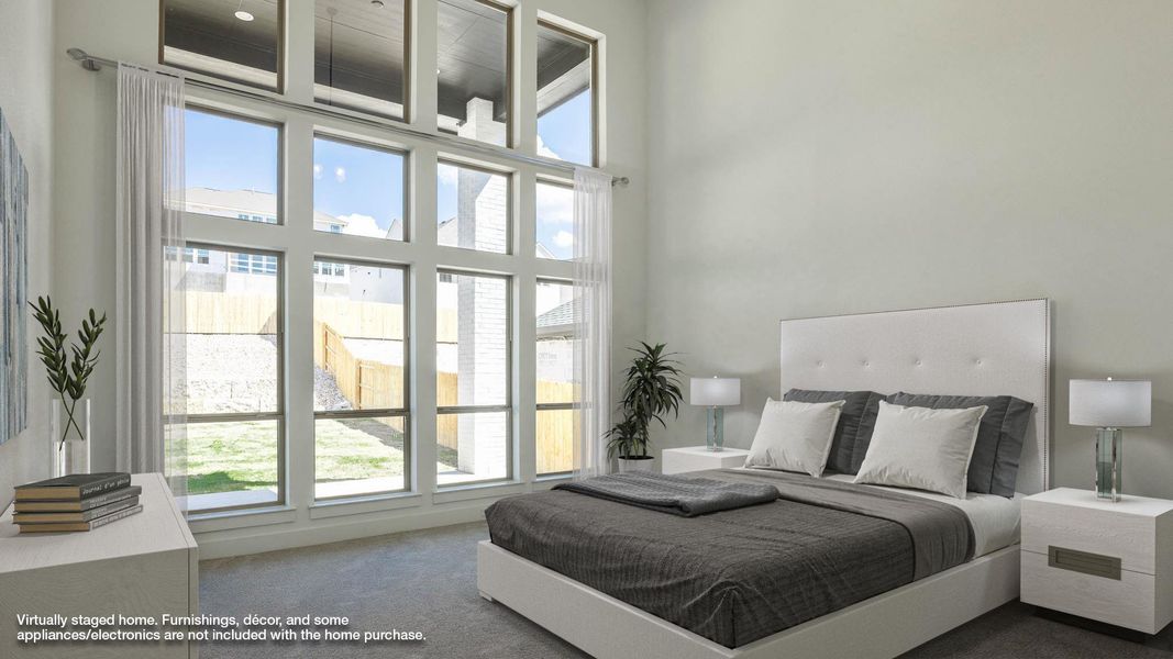 Bedroom with carpet and a high ceiling
