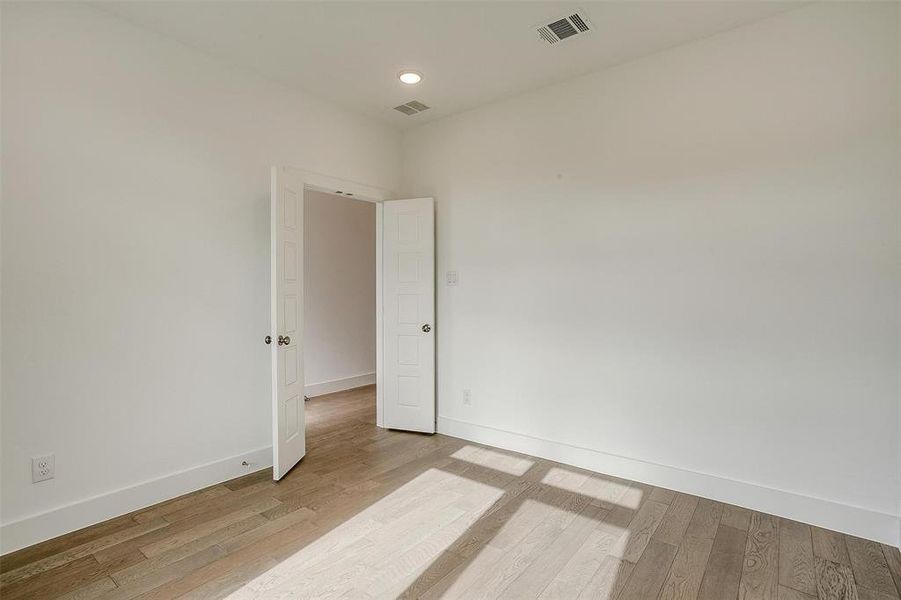 Empty room featuring light hardwood / wood-style flooring