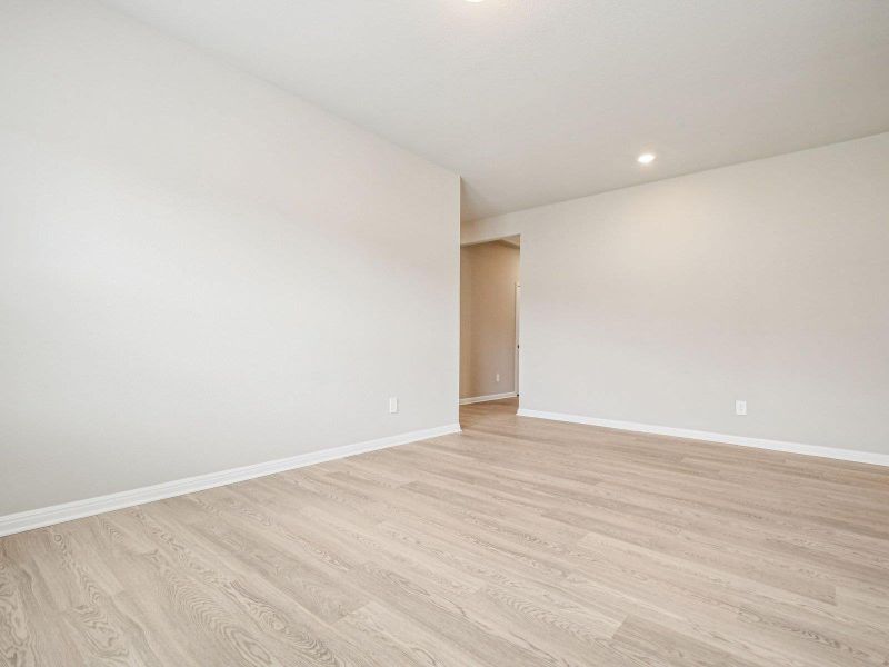 Spare room with light wood-style flooring and recessed lighting Spare room with light wood-style flooring and recessed lighting