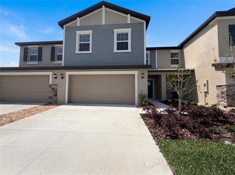 Front exterior of a new home in , Parrish, FL, highlighting curb appeal (Image 1). Front exterior of a new home in , Parrish, FL, highlighting curb appeal (Image 1).