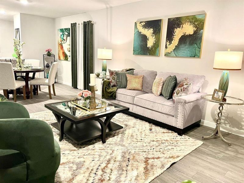 Living room featuring wood finished floors and baseboards