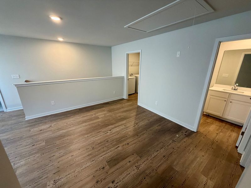 A room with a wood floor. A room with a wood floor.