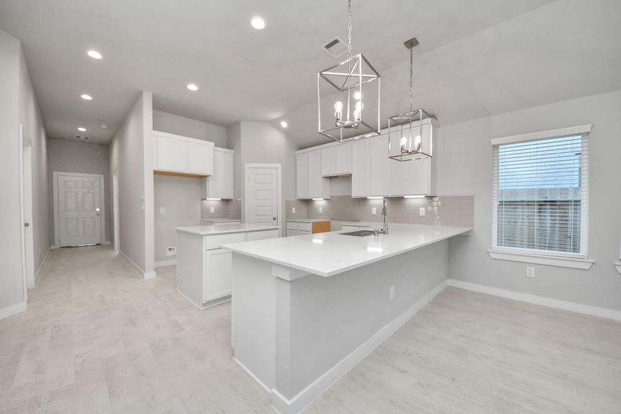 This generously spacious kitchen is a dream realized! Sample photo of completed home with similar floor plan. Actual colors and selections may vary.