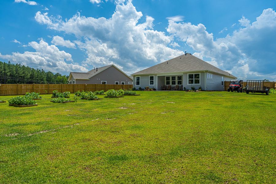 Exterior details and patio area of a home in French Quarter Creek, Huger (Image 4).