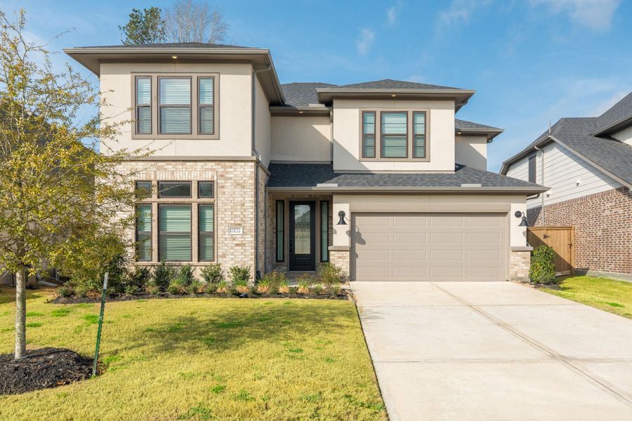 Front exterior of a new home in , Porter, TX, highlighting curb appeal (Image 21).