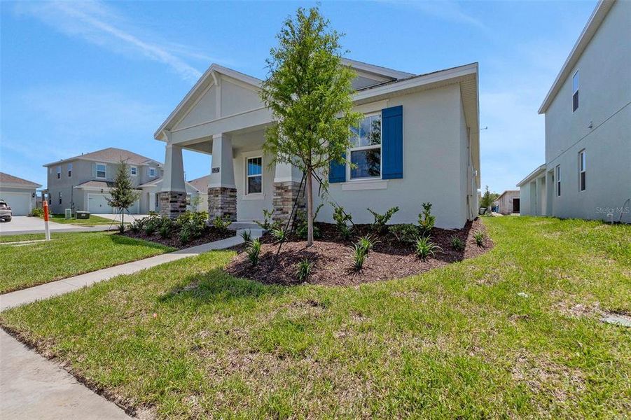Front exterior of a new home in Crossroads at Kelly Park, Apopka, FL, highlighting curb appeal (Image 28).