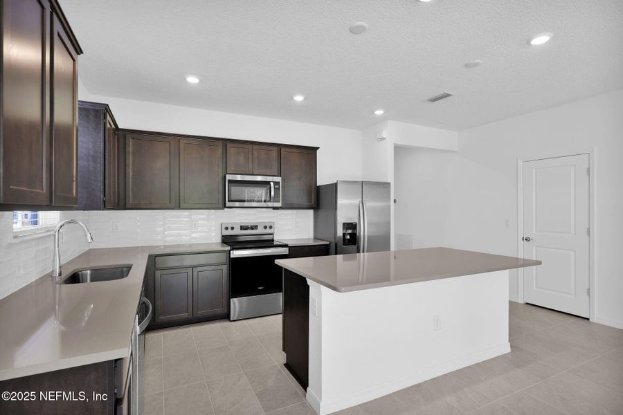 Furnished interior view inside a new home in Hyland Trail, Green Cove Springs (Image 4).