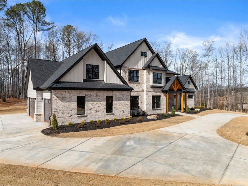 Front exterior of a new home in , Hoschton, GA, highlighting curb appeal (Image 37). Front exterior of a new home in , Hoschton, GA, highlighting curb appeal (Image 37).