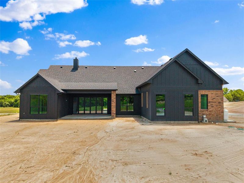 Front exterior of a new home in , Poolville, TX, highlighting curb appeal (Image 26). Front exterior of a new home in , Poolville, TX, highlighting curb appeal (Image 26).