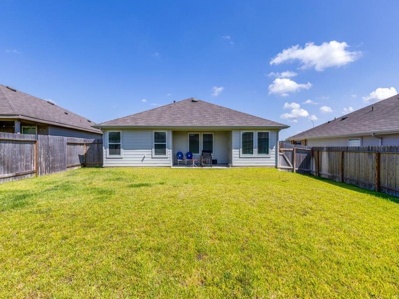 Exterior details and patio area of a home in Grand Pines, Magnolia (Image 4).