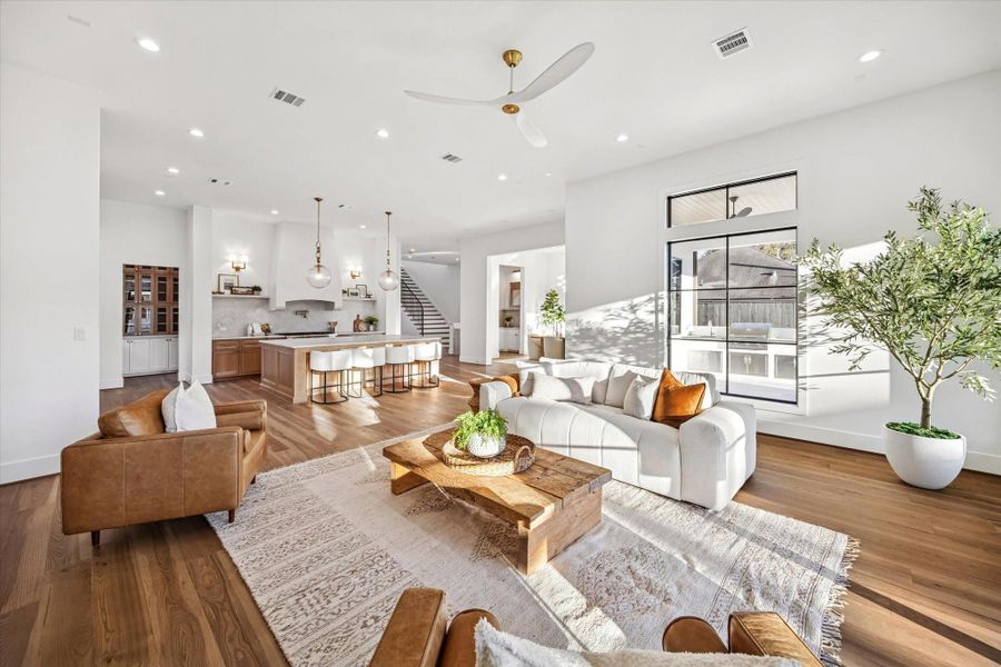 Open living, kitchen, and dining areas come together in a bright, expansive layout designed for both daily life and entertaining. Wide plank floors, generous ceiling height, and clear sightlines reinforce a sense of flow and connection throughout the main level. **Previous build by Arch Angelo** Open living, kitchen, and dining areas come together in a bright, expansive layout designed for both daily life and entertaining. Wide plank floors, generous ceiling height, and clear sightlines reinforce a sense of flow and connection throughout the main level. **Previous build by Arch Angelo**