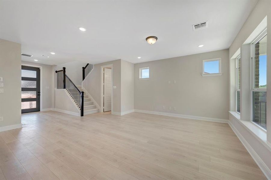 Basement featuring light wood finished floors and recessed lighting