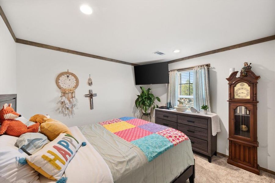 Bedroom featuring light colored carpet and recessed lighting Bedroom featuring light colored carpet and recessed lighting