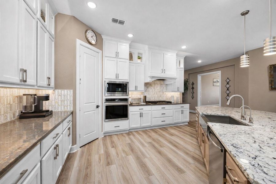 Large walk-in pantry with more than enough shelving to store the goodies.