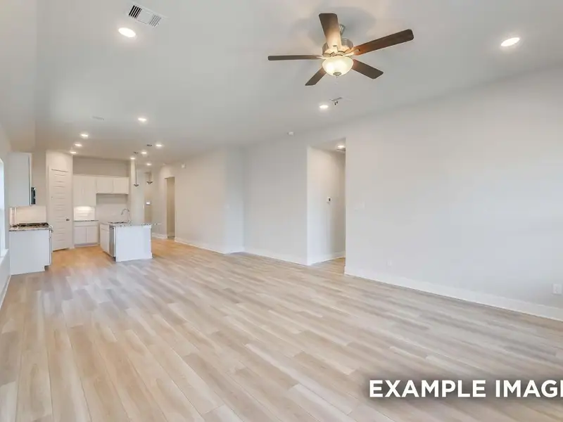Spacious, unfurnished interior of a new home in Sunterra, Katy (Image 14).