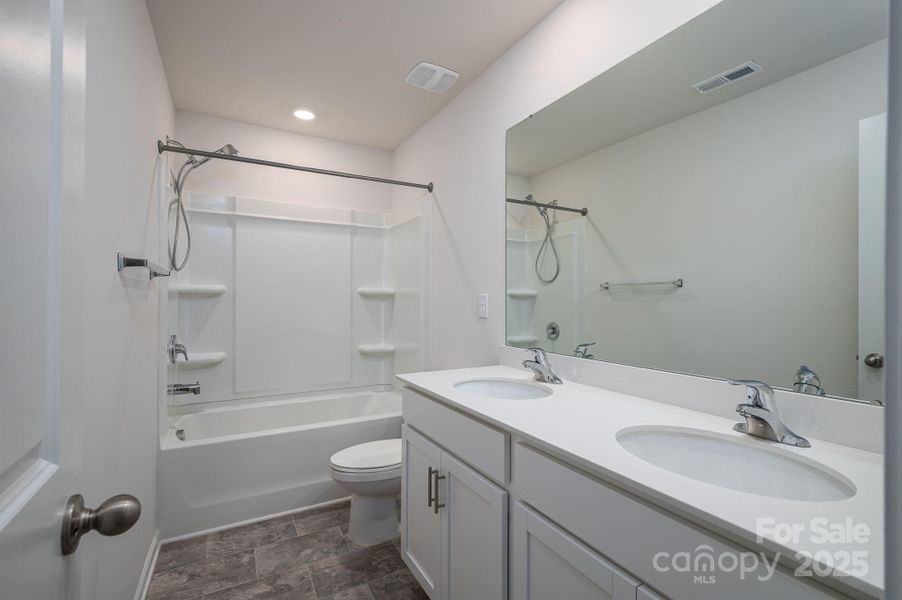 Furnished interior view inside a new home in Mills at Long Creek, Dallas (Image 10).