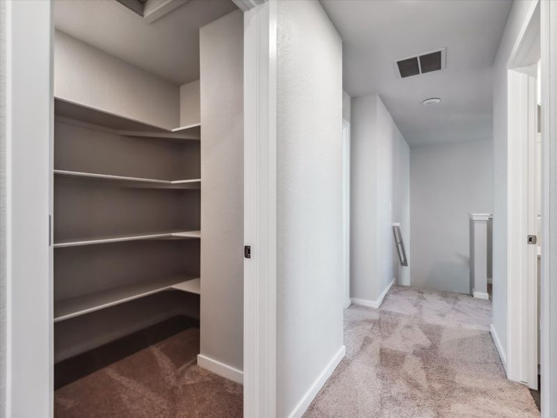 A hallway with white walls.
