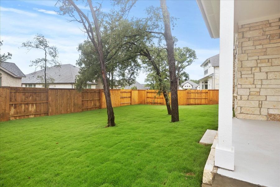 Front exterior of a new home in 6 Creeks, Kyle, TX, highlighting curb appeal (Image 24). Front exterior of a new home in 6 Creeks, Kyle, TX, highlighting curb appeal (Image 24).