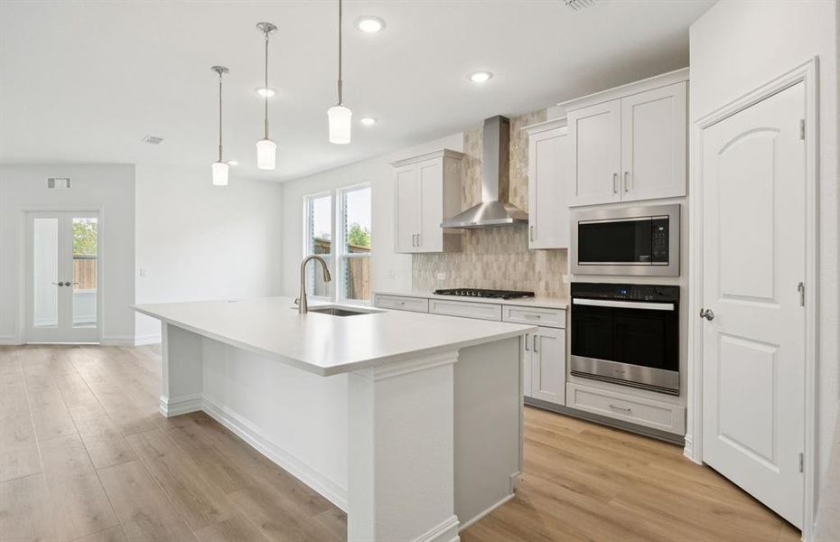 Spacious kitchen with eat-in bartop island Spacious kitchen with eat-in bartop island