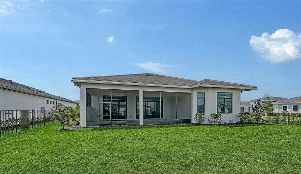 Exterior details and patio area of a home in Artistry Sarasota, Sarasota (Image 4).