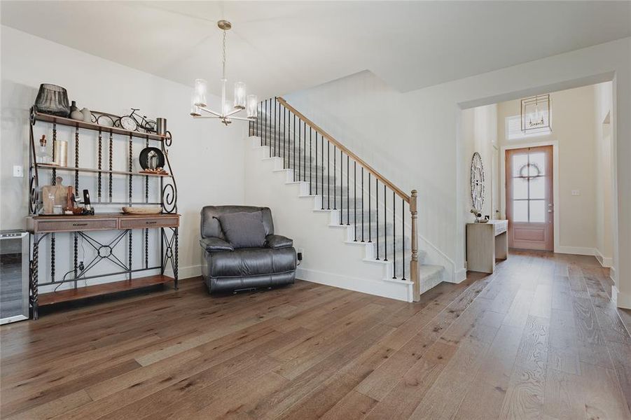 Hardwood-finish flooring extending through the entry and main living area